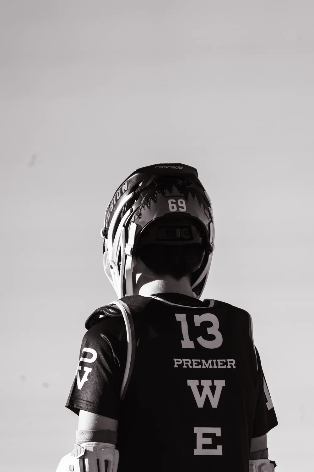Premier West player wearing number 13, viewed from behind